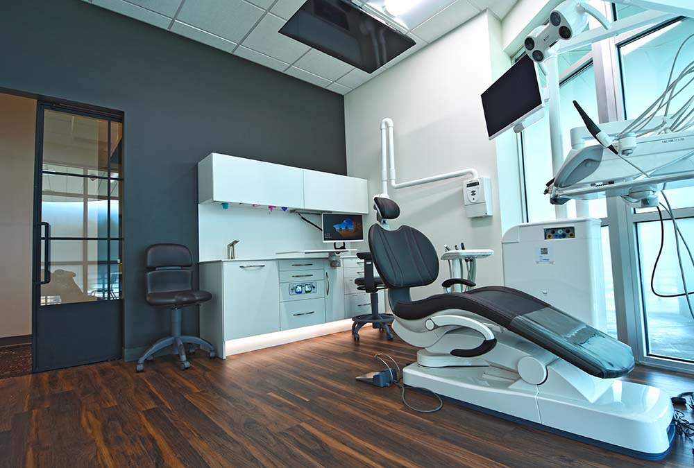 Modern dental treatment room with large windows