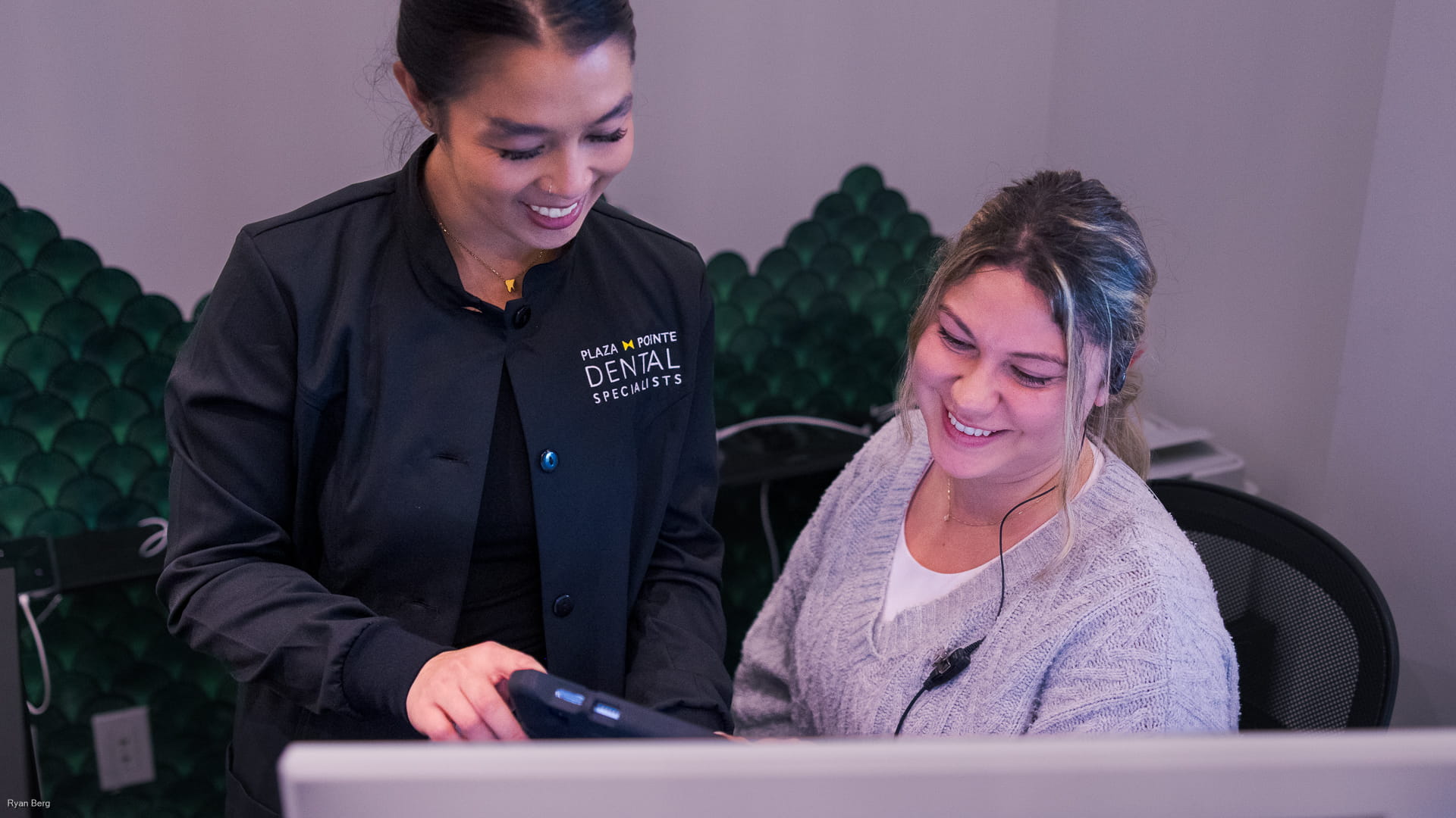 A Plaza Pointe team member helping a patient