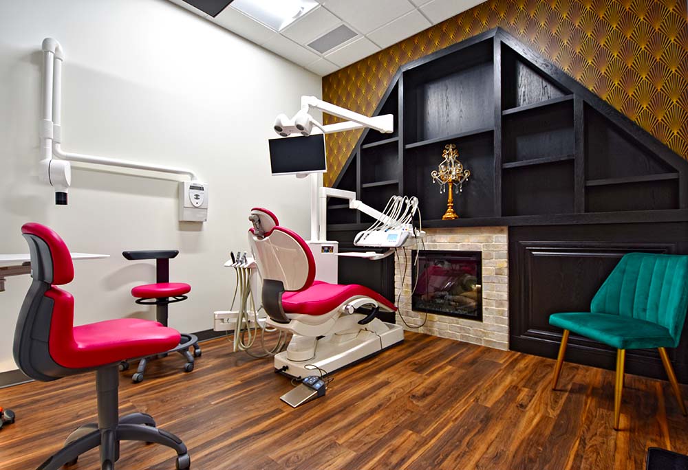 Dental treatment room with a fireplace and feature wall