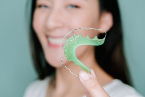 woman holding a retainer